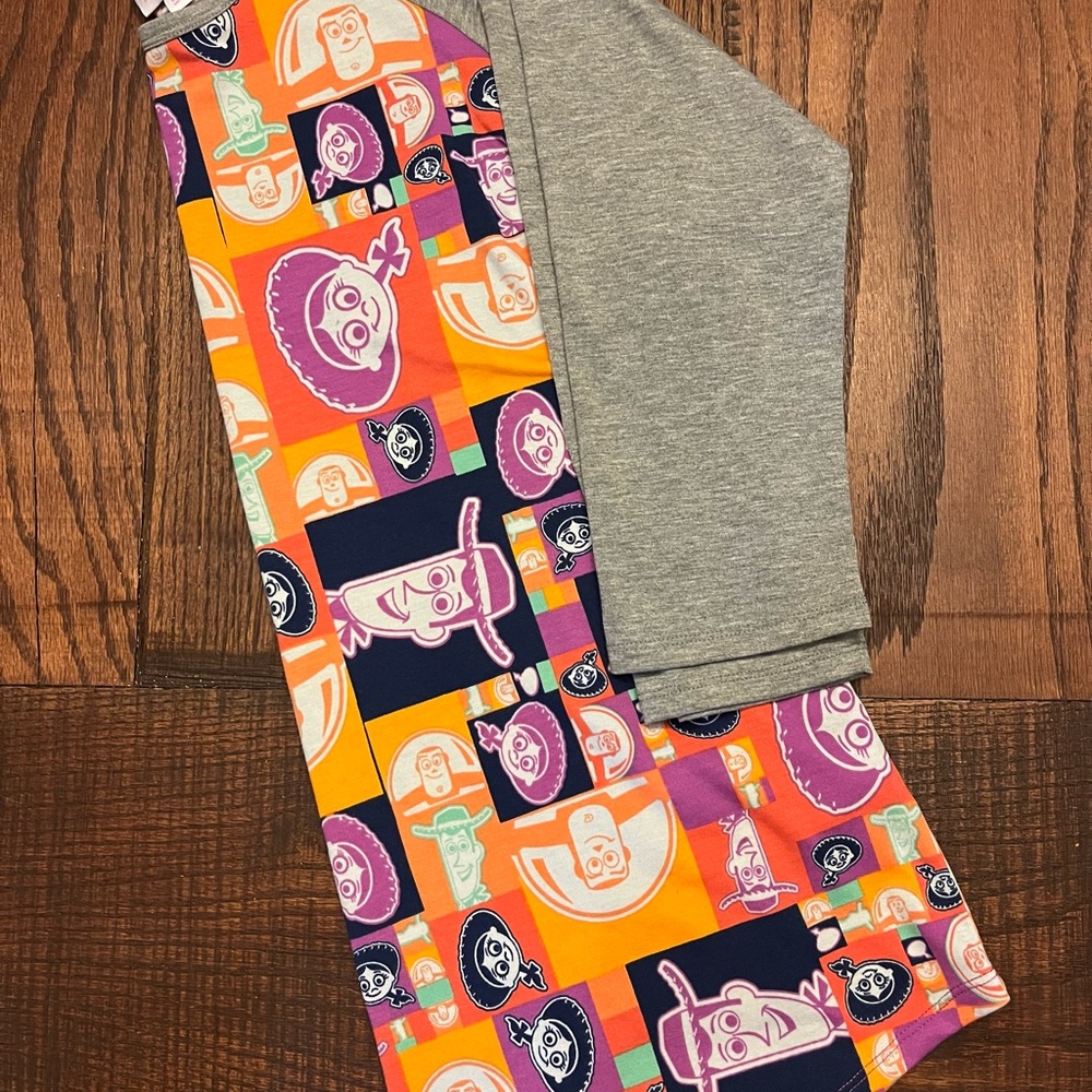 LuLaRoe Orange and Multicolor Toy Story Disney Randy top.